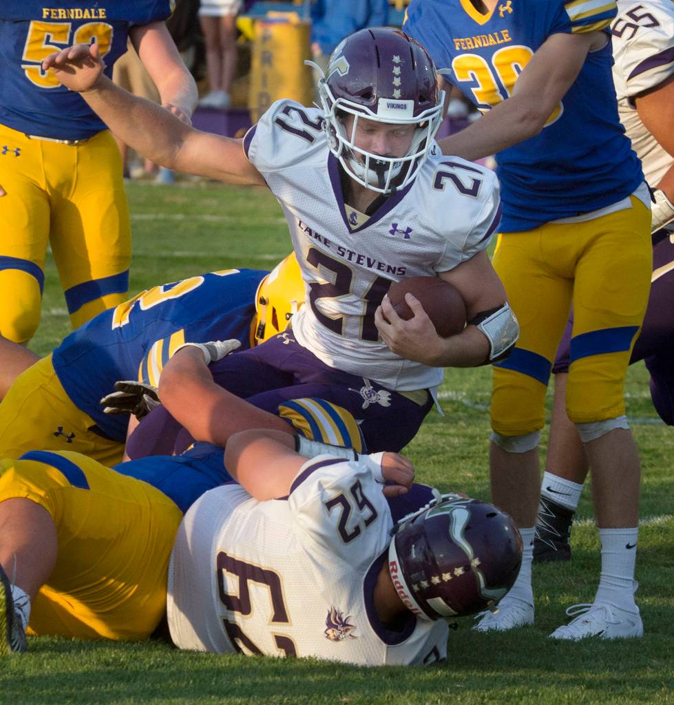 Lake Stevens Jackson Grafe (21) powers into the end zone for a touchdown as the Vikings took a 21-0 lead in the first half against Ferndale on Aug. 31, 2018, in Ferndale. (Andy Bronson / The Herald)