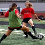 Gracie VanAssche attempts a pass during practice at Snohomish High School on Sept. 7, 2018 in Snohomish, Wa. (Olivia Vanni / The Herald)