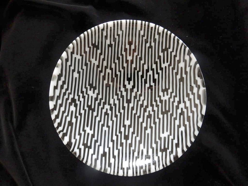 This piece called Strips is one example of the work by Lynn McManus, who specializes in fused kiln worked glass.