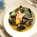 Gordons mussels and clams in coconut curry broth can be served as an appetizer or entree. (Andy Bronson / The Herald)