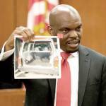Edirin Okoloko, a Snohomish County deputy prosecutor, shows a photo of a car involved in a murder case at trial in 2016. Okoloko was named a Superior Court judge Tuesday by Gov. Jay Inslee. (Andy Bronson / Herald file)