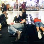 Passengers wait to board their flights at Sea-Tac Airport on Aug. 26, 2018. (Sue Misao / The Herald)