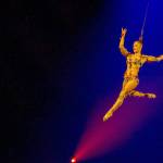 A woman performs an aerial routine suspended by her hair in Volta. (Benoit Z. Leroux)