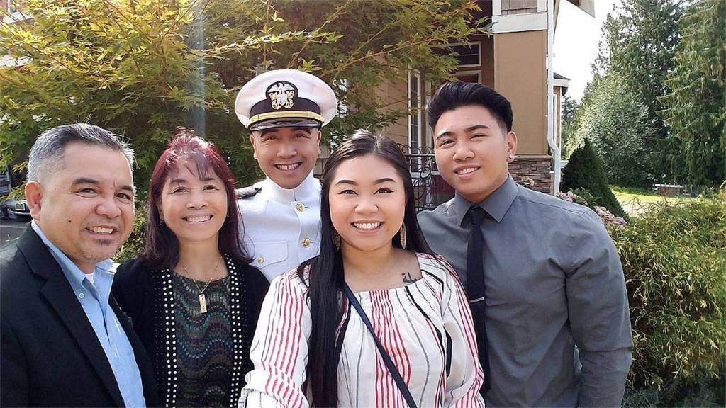 U.S. Navy Ensign Leighton Flores celebrates his Sept. 9 commissioning with family at Naval Station Everett. (Contributed photo)