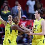 The Storms Sue Bird (back left), Jewell Loyd (center) and Breanna Stewart (30) react during the first half of Game 3 of the WNBA finals against the Mystics on Sept. 12, 2018, in Fairfax, Va. (AP Photo/Nick Wass)