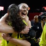 Storm forward Breanna Stewart (rear) hugs teammate Sue Bird on the court after beating the Mystics 98-82 to win the WNBA championship on Sept. 18 2018, in Fairfax, Va. (AP Photo/Carolyn Kaster)