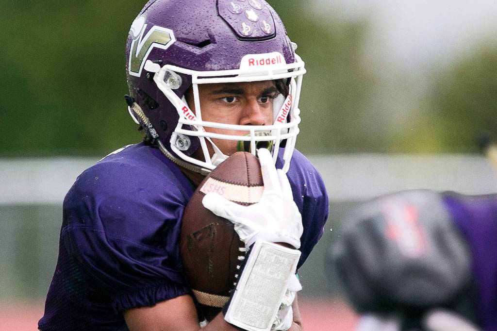 Lake Stevens junior Kasen Kinchen looks up field after a reception during practice on Sept. 13 in Lake Stevens. (Kevin Clark / The Herald)