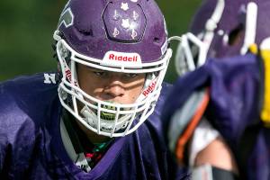 Lake Stevens Kasen Kinchen eyes his teammate on the line of scrimmage during practice Thursday afternoon in Lake Stevens on September 13, 2018. (Kevin Clark / The Herald)