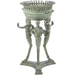 Three men with animal feet hold this Roman brazier on their heads. It is a copy of an excavated piece from Pompeii that was buried in 78 A.D. Many pictures and artifacts showed life in the town, a place for entertainment and erotica. (Cowles Syndicate Inc.)