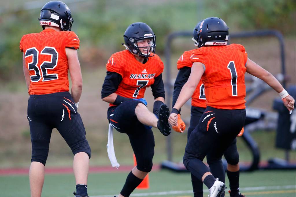 Monroes Efton Chism III (7) celebrates a touchdown with his teammates in the second quarter of Friday nights game. (Andy Bronson / The Herald)