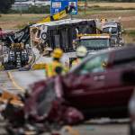 A trailer on I-5 southbound north of the Highway 530 interchange is lifted onto a tow truck Sunday afternoon in Arlington. (Olivia Vanni / The Herald)
