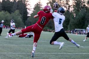 Archbishop Murphys Josh McCarron (left) and Hockinsons Wyatt Jones battle for a ball during a Sept. 6 game in Everett. McCarron and the 1-1 Wildcats will travel to Lynden on Friday to face the Lions in a matchup of 2A powerhouses. (Kevin Clark / The Herald)