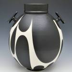 Shoreline ceramic artist Sam Scotts Black and White Jar With Handles won first place in artistians works in Arts of the Terrace.                                Shoreline ceramic artist Sam Scotts Black and White Jar With Handles won first place in artistians work in Arts of the Terrace.