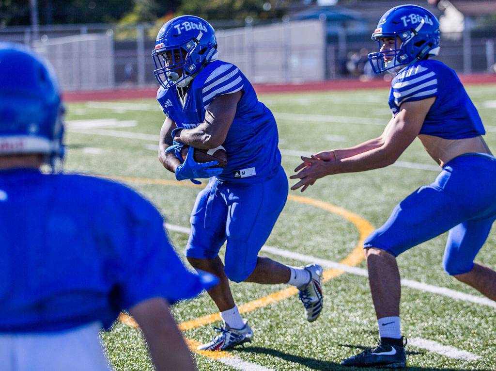 Shorewood running back Robert Banks runs the ball during practice Wednesday afternoon at Shorewood High School in Shoreline. The Thunderbirds ended a 17-game Wesco 3A South losing streak two weeks ago with a 38-7 win over perennial league power Meadowdale. (Olivia Vanni / The Herald)