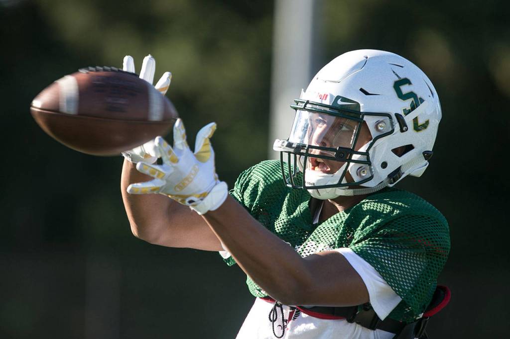Shorecrest receiver Antonio Stillwell catches the ball during practice Wednesday afternoon at Shorecrest High School in Shoreline. Stillwell leads the Scots big-play passing attack with 382 yards receiving and five touchdown catches through three games. (Kevin Clark / The Herald)