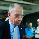 Senate Judiciary Committee Chairman Sen. Chuck Grassley walks through a tunnel towards the Dirksen Senate Building on Capitol Hill in Washington on Wednesday. (AP Photo/Manuel Balce Ceneta)