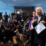 Sen. Kirsten Gillibrand, D-N.Y., joined at rear by Sen. Mazie Hirono, D-Hawaii, holds a letter of support from alumnae from the Holton-Arms School, the Maryland all-girls school that Christine Blasey Ford attended in the early 1980s, during a news conference on Capitol Hill in Washington, on Thursday. (AP Photo/J. Scott Applewhite)