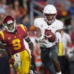 Washington State wide receiver Easop Winston (right) makes a catch next to Southern California cornerback Greg Johnson during the first half of a game on Sept. 21, 2018, in Los Angeles. (AP Photo/Jae C. Hong)