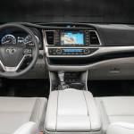 Stowage space inside the 2018 Toyota Highlander midsize SUV includes a handy tray along the lower dash. (Manufacturer photo)