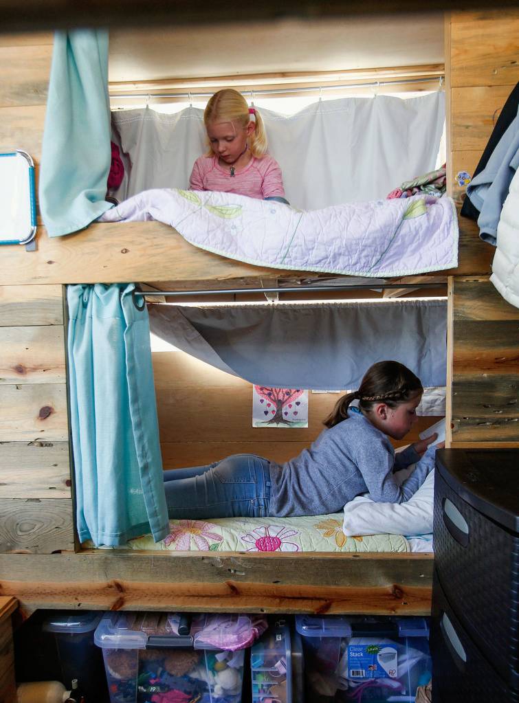 Each of the Taisey kids have their own custom beds with privacy curtains and wall-to-wall mattresses. (Dan Bates / The Herald)