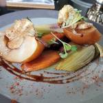 Stuffed baked pears with cashew blue cheese, grilled fennel bulb and rainbow carrots at Sage & Cinder, a vegan restaurant in Mukilteo. (Sharon Salyer / The Herald)