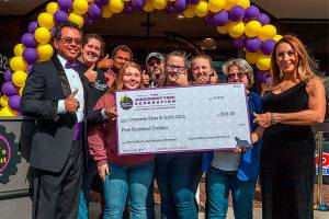 New gym celebrates with donation to Boys & Girls Club