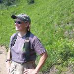 Bridget Wisniewski stops on a hike up the North Fork Sauk River Trail to the Pacific Crest Trail at White Pass. (Loren Drummond/Washington Trails Association)