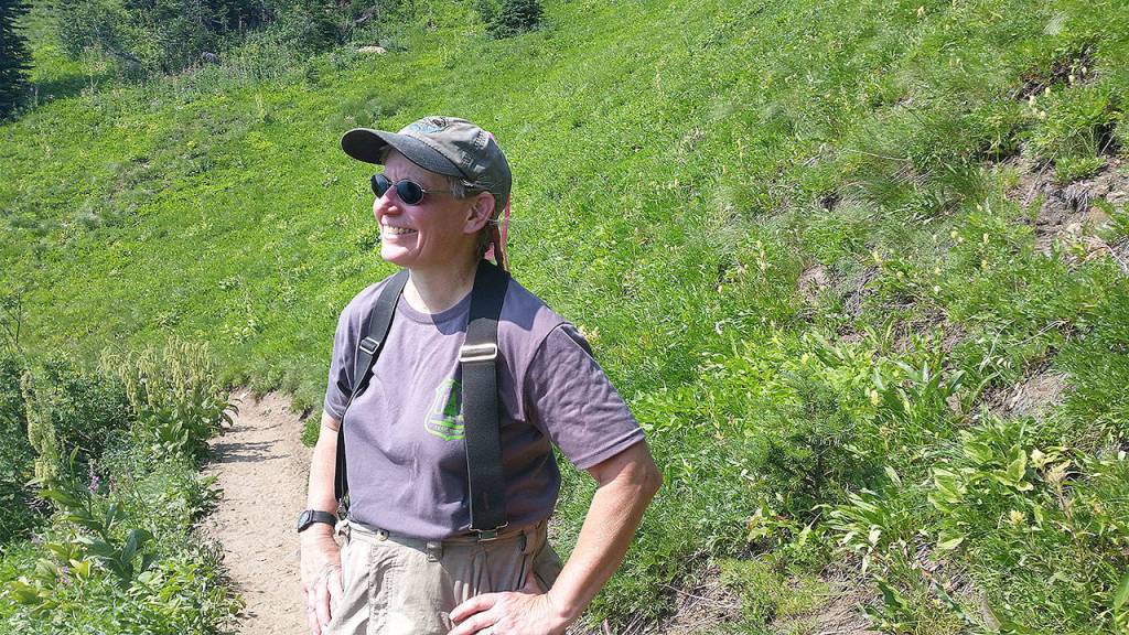 Bridget Wisniewski stops on a hike up the North Fork Sauk River Trail to the Pacific Crest Trail at White Pass. (Loren Drummond/Washington Trails Association)