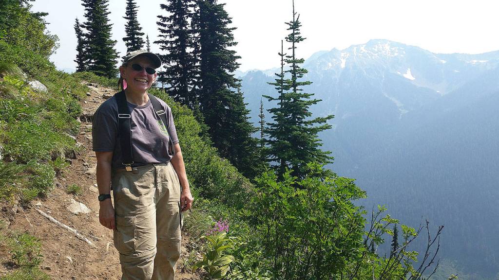 Bridget Wisniewski stops on a hike up the North Fork Sauk River Trail to the Pacific Crest Trail at White Pass. (Loren Drummond/Washington Trails Association)