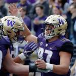 Washingtons Cade Otton (87) is congratulated after scoring against North Dakota in the second half of a game Sept. 8, 2018, in Seattle. (AP Photo/Elaine Thompson)