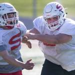 Snohmishs Brayden Ulrich (left) is blocked by teammate Derek Stultz during a Thursday practice session at Veterans Memorial Stadium. (Kevin Clark / The Herald)