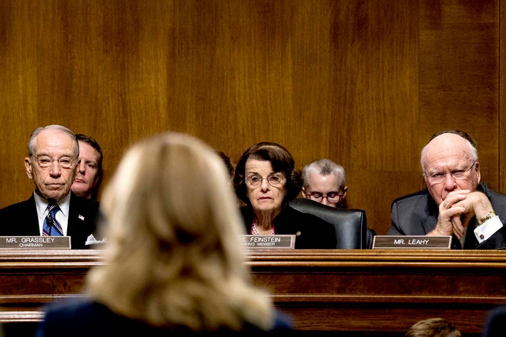 From left, Sen. Chuck Grassley, R-Iowa, Sen. Dianne Feinstein, D-Calif., and Sen. Patrick Leahy, D-Vt., listen as Christine Blasey Ford testifies before the Senate Judiciary Committee on Thursday on Capitol Hill in Washington. (Tom Williams/Pool Image via AP)