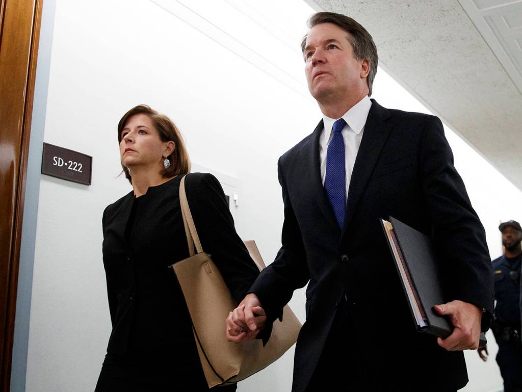 Brett Kavanaugh and his wife, Ashley Estes Kavanaugh, hold hands as they arrive for a Senate Judiciary Committee hearing on Capitol Hill in Washington on Thursday. (AP Photo/Carolyn Kaster)