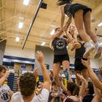 Everett High School cheerleaders and football players work together during rehearsal in the Everett High School gym on Sept. 26. (Olivia Vanni / The Herald)