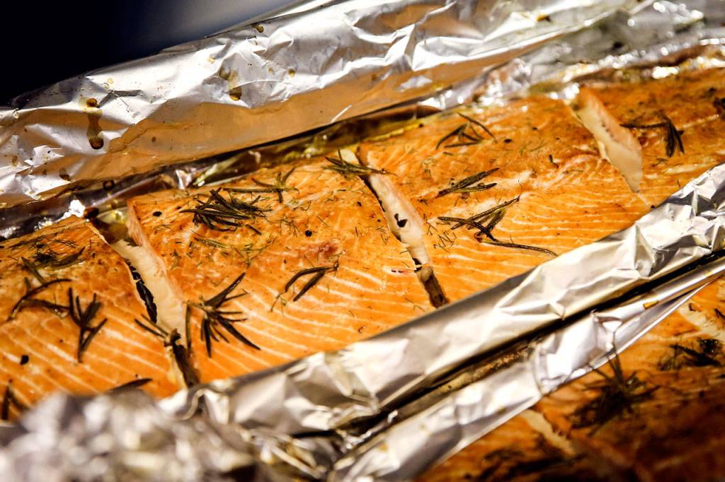 Some 200 pounds of grilled salmon were served at the fundraiser. (Kevin Clark / The Herald)