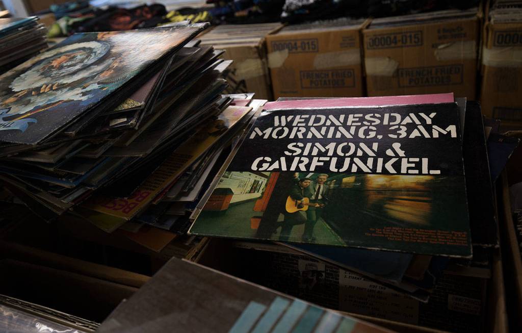 A Simon & Garfunkel record sits among the stacks of unsorted and unpriced albums in The Vinyl Garage owned by Kevin Grigsby. (Andy Bronson / The Herald)