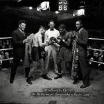 Leslie Wildcat Carter (boxer on right) in a bout with Doc Snell, another featherweight fighter, in Tacoma in 1927. In the 1920s, Carter lived in Everetts Riverside neighborhood. As a professional boxer he earned $250,000 in three years, according to a 1930 Everett Herald article. (Washington State Historical Society)