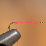 Place hook in vise and add thread base for feathers. (Mike Benbow photo)