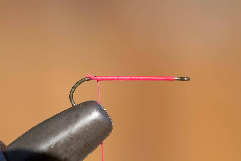 Place hook in vise and add thread base for feathers. (Mike Benbow photo)