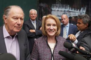David Bonderman (left) and Seattle Mayor Jenny Durkan talk to the media as they leave a meeting at NHL headquarters Tuesday in New York. (AP Photo/Mark Lennihan)