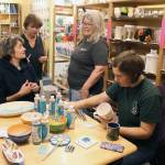 Whidbey Art Escape in Freeland has been the gathering spot every Wednesday night for a group of women who chat, laugh and relax while painting ceramic pottery or creating other art. Owner Tina Beard is selling her business after 15 years. (Patricia Guthrie / Whidbey News Group)