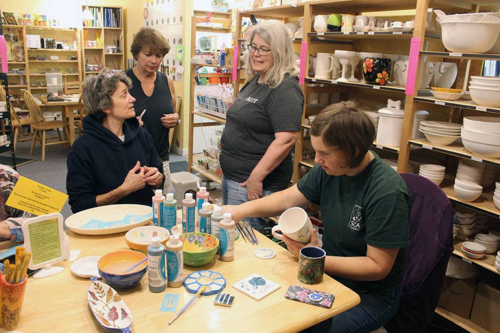 Whidbey Art Escape in Freeland has been the gathering spot every Wednesday night for a group of women who chat, laugh and relax while painting ceramic pottery or creating other art. Owner Tina Beard is selling her business after 15 years. (Patricia Guthrie / Whidbey News Group)