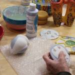 Whidbey Art Escape in Freeland has been the gathering spot every Wednesday night for a group of women who chat, laugh and relax while painting ceramic pottery or creating other art. Owner Tina Beard is selling her business after 15 years. (Patricia Guthrie / Whidbey News Group)