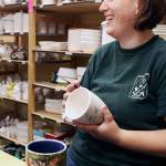 Jackie Ballog has been painting mugs and other creations at Whidbey Art Escape since she was teenager. (Patricia Guthrie / Whidbey News Group)