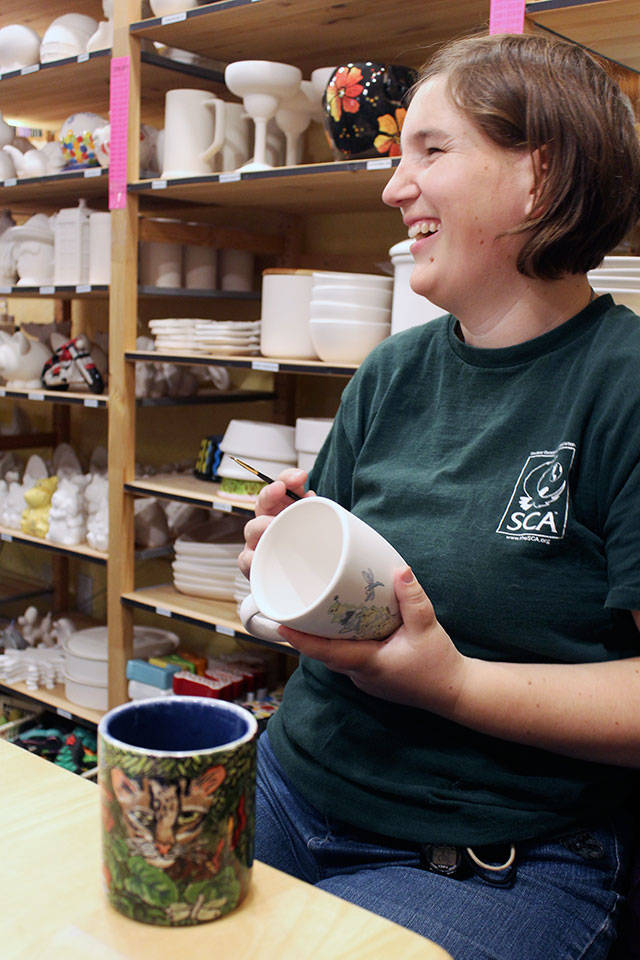 Jackie Ballog has been painting mugs and other creations at Whidbey Art Escape since she was teenager. (Patricia Guthrie / Whidbey News Group)
