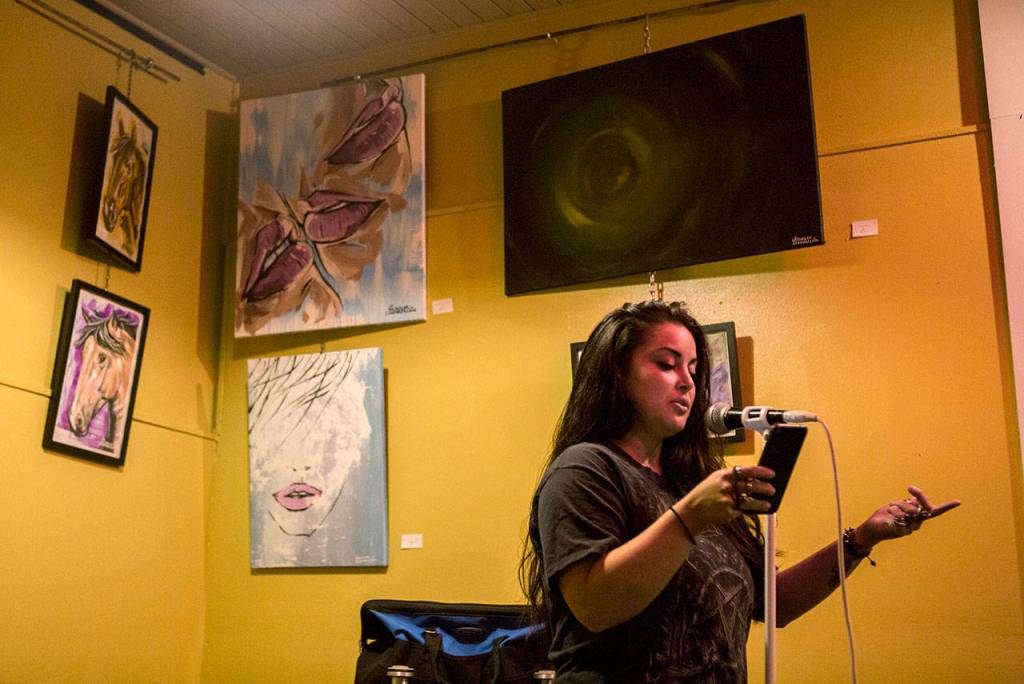Kendra Steel, 24, recites a poem during Everett Poetry Nite at Cafe Zippy on Oct. 4 in Everett. (Olivia Vanni / The Herald)