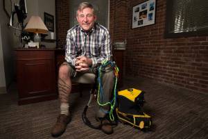  Bellingham resident Dave Mauro has a tattoo, of representing each of the highest peak on every continent that he has summited, on his shin. At his office on Tuesday, Oct. 2, 2018 in Bellingham, Wa. (Andy Bronson / The Herald)