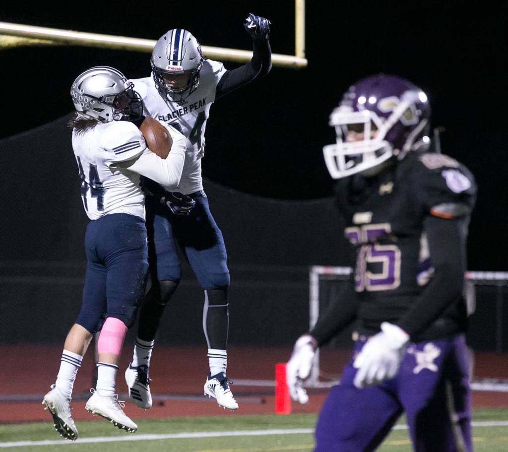 Glacier Peaks Trevor Meldrom (left) celebrates his touchdown with Evan Mannes Friday night at Lake Stevens High School on October 5, 2018. (Kevin Clark / The Herald)