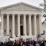 Activists demonstrate in front of the Supreme Court to protest the confirmation vote of Supreme Court nominee Brett Kavanaugh on Capitol Hill on Saturday in Washington. (AP Photo/Alex Brandon)