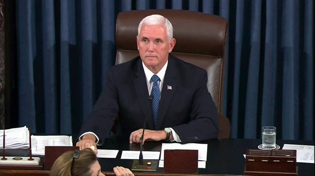 Vice President Mike Pence calls for the Sergeant at Arms to restore order in the Senate gallery as a protester yells during the start of the vote for the confirmation of Brett Kavanaugh to the Supreme Court in Washington. (AP Photo/APTN)